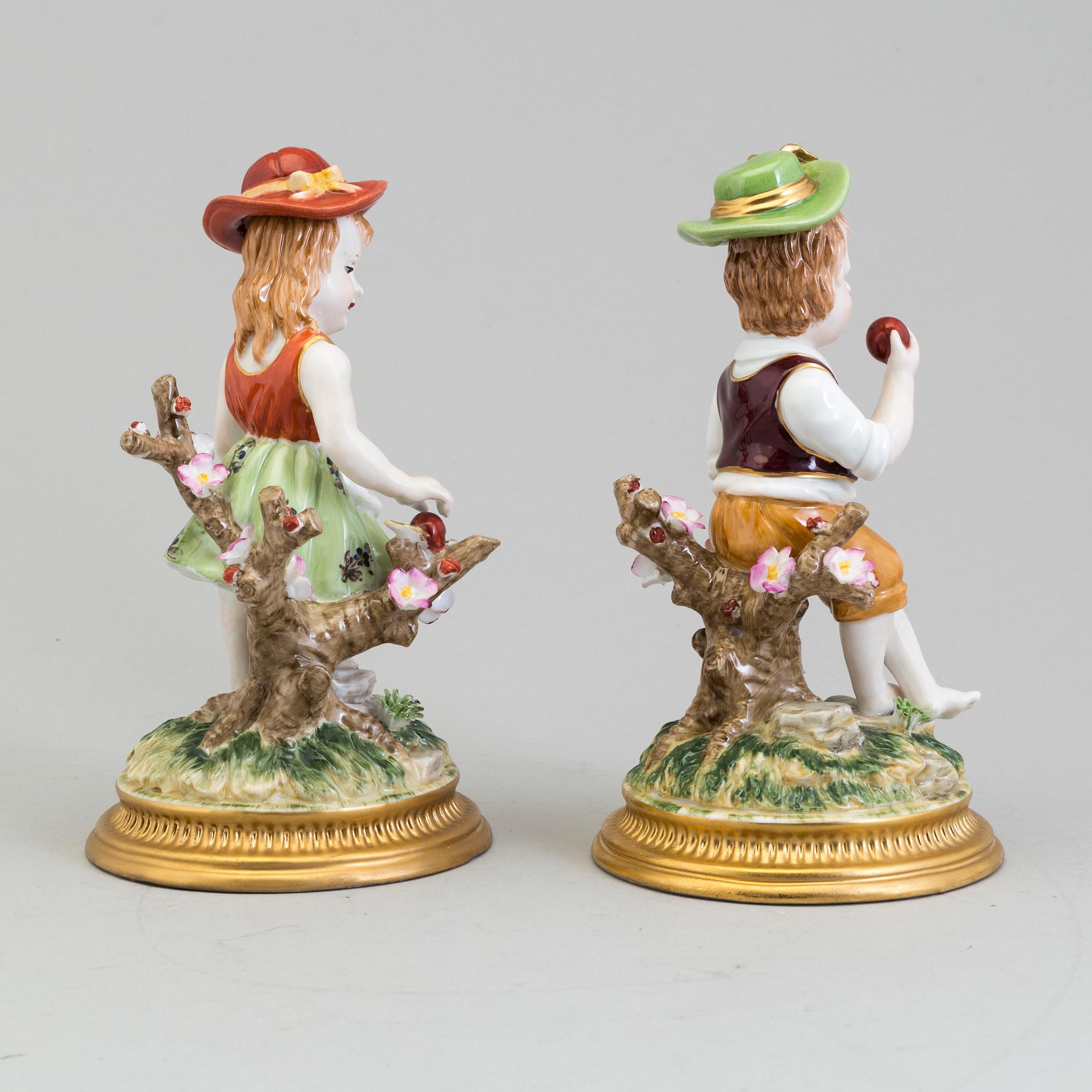 a pair of porcelain figurines marked similar to meissen, 20th century.