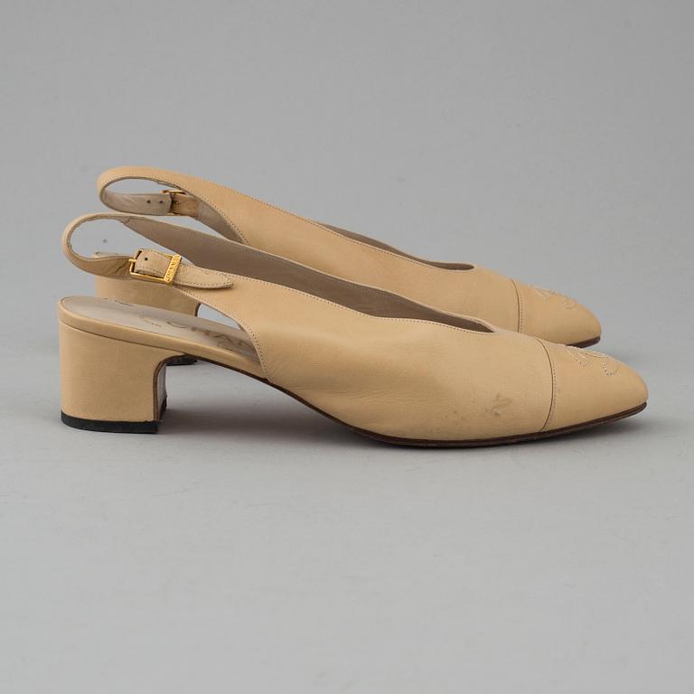 Beige leather slingbacks by Chanel.