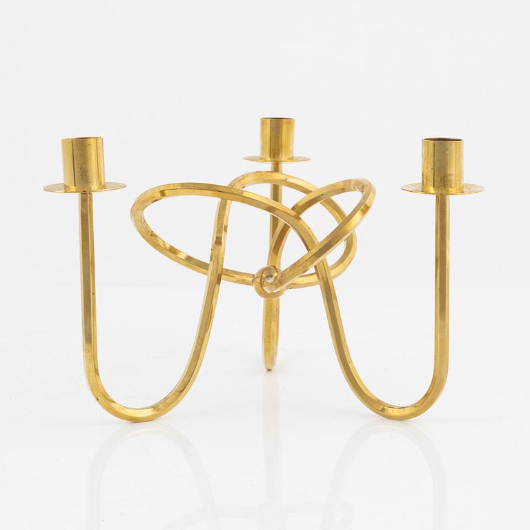 Josef Frank, a brass candelabrum, 'Vänskapsknuten', Svenskt Tenn.