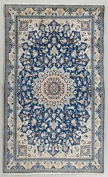 A Nain rug, part silk, 183 x 110 cm.