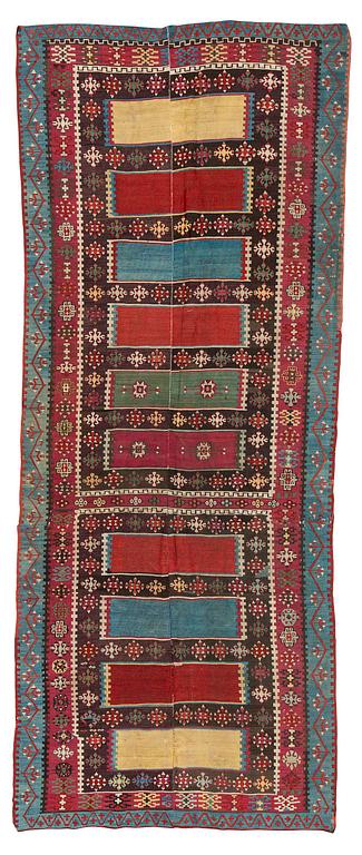 An antique Anatolian kilim, c. 374 x 148 cm.