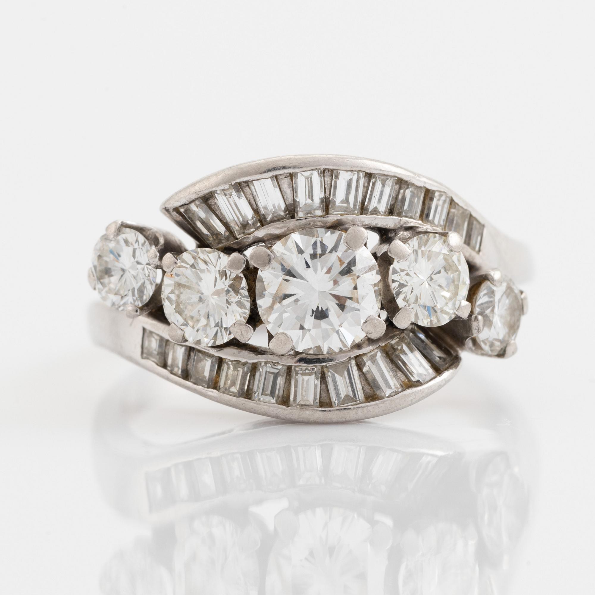 Platinum, brilliant and baguette cut diamond ring.