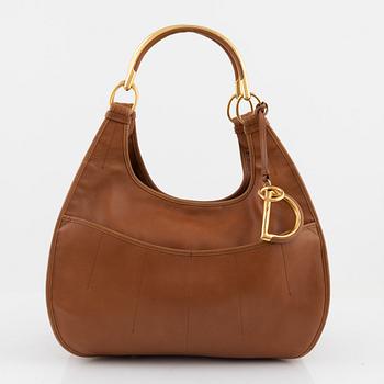 Christian Dior, a brown leather handbag.