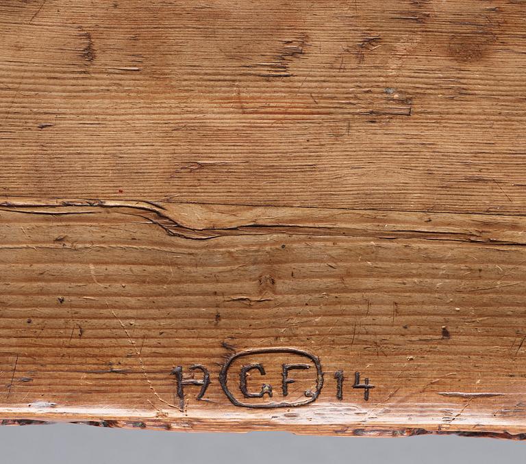 Gustaf Fjaestad, an Art Nouveau carved pine table, Arvika Sweden 1914, a double to the table in the Thiel Collection,