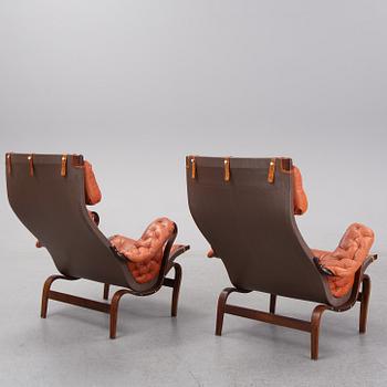 An end of the 20th Century pair of 'Pernilla' easy chairs with leather upholstery by Bruno Mathsson for DUX.