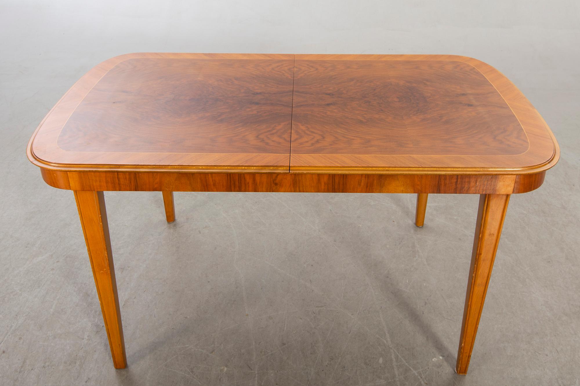 A 1950/60's dining table and chairs.