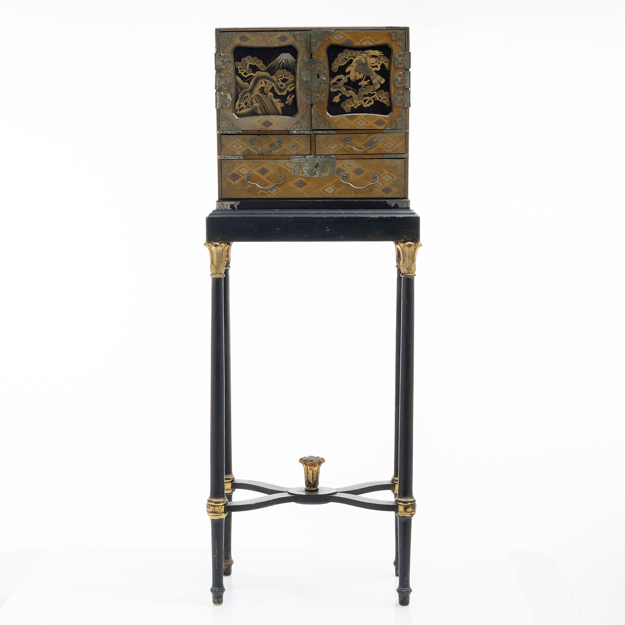 A maki-e cabinet on stand, Japan, 19th century.
