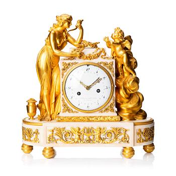 126. A Louis XVI marble and ormolu mantel clock, late 18th century.