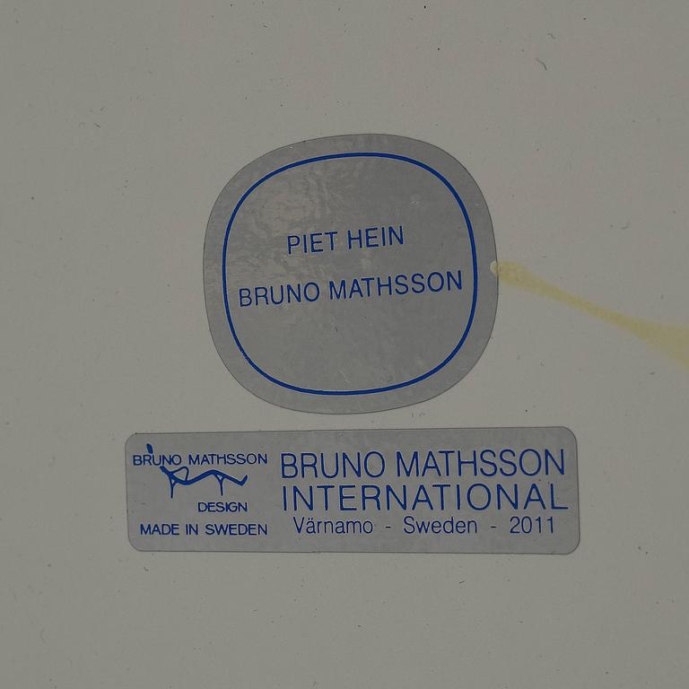 A 'Superellips" table by Bruno Mathsson & Piet Hein for Mathsson International darted 2011.