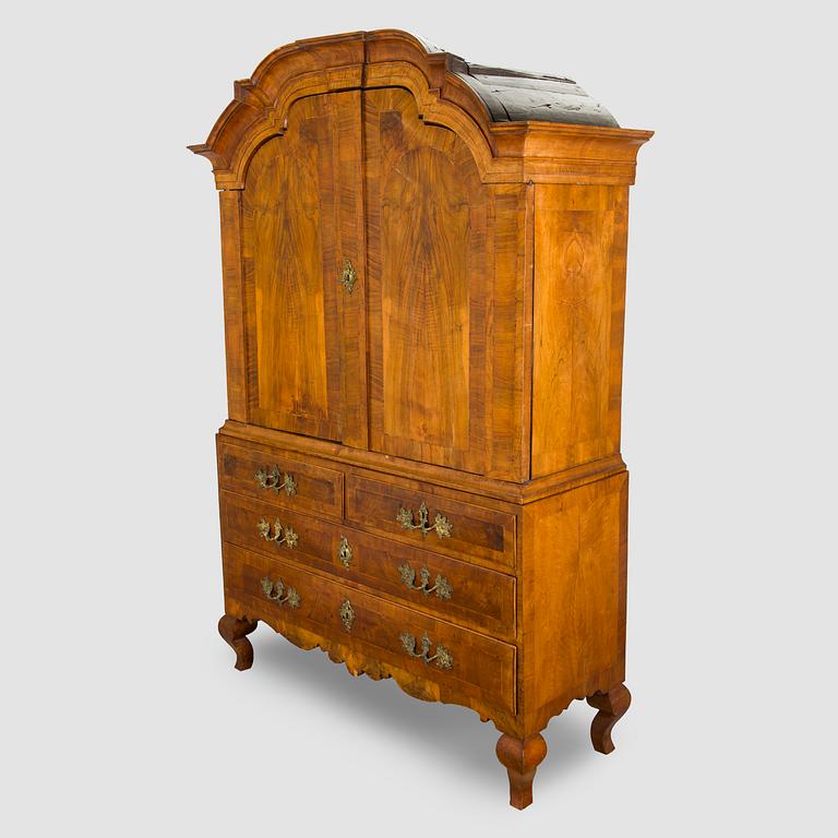 A Swedish walnut-veneered rococo cabinet in the manner of C. Linning, latter half of the 18th Century.