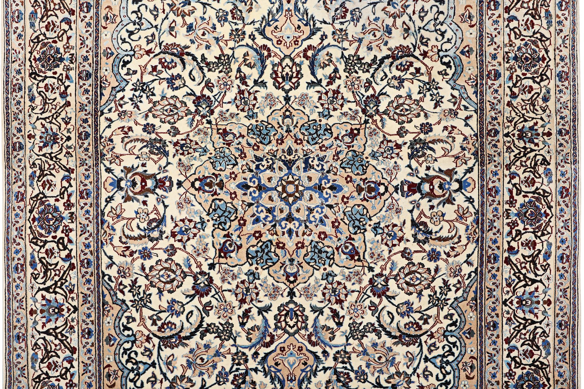 A Nain carpet, part silk, 9 laa, c. 318 x 209 cm.