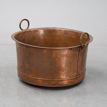 An 19th Century copper cauldron.