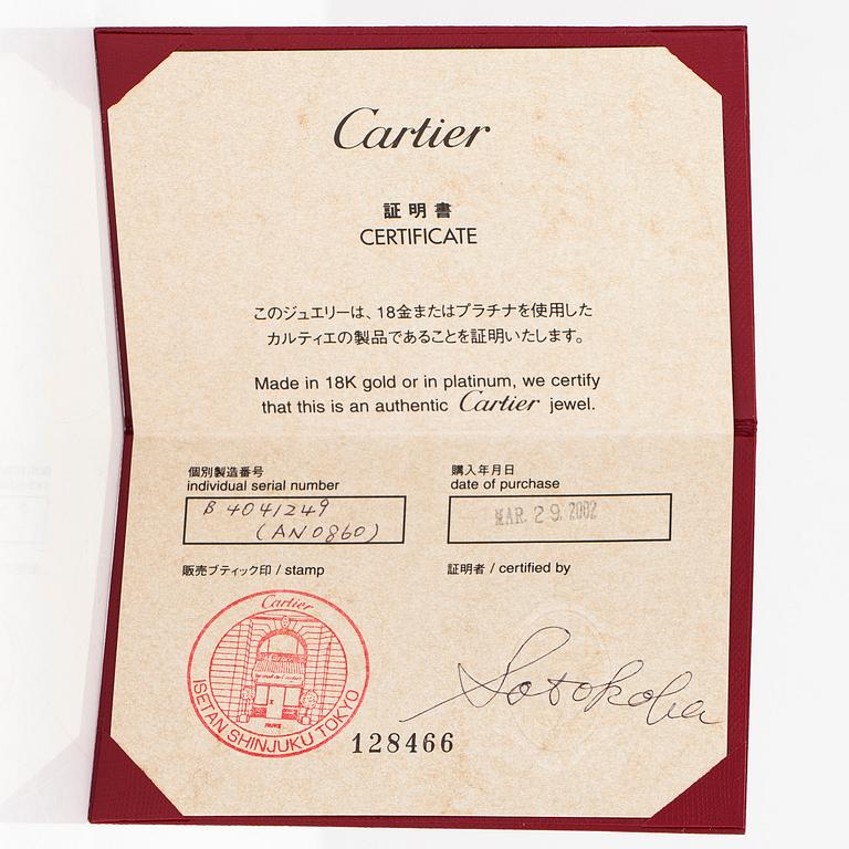 Cartier, a platinum ring. With certificate.