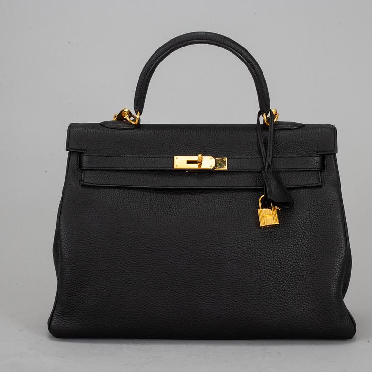 HERMÈS, a 'Kelly 35' black leather bag.
