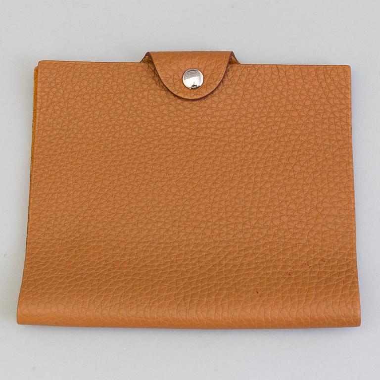 A leather Hermès notebook case.