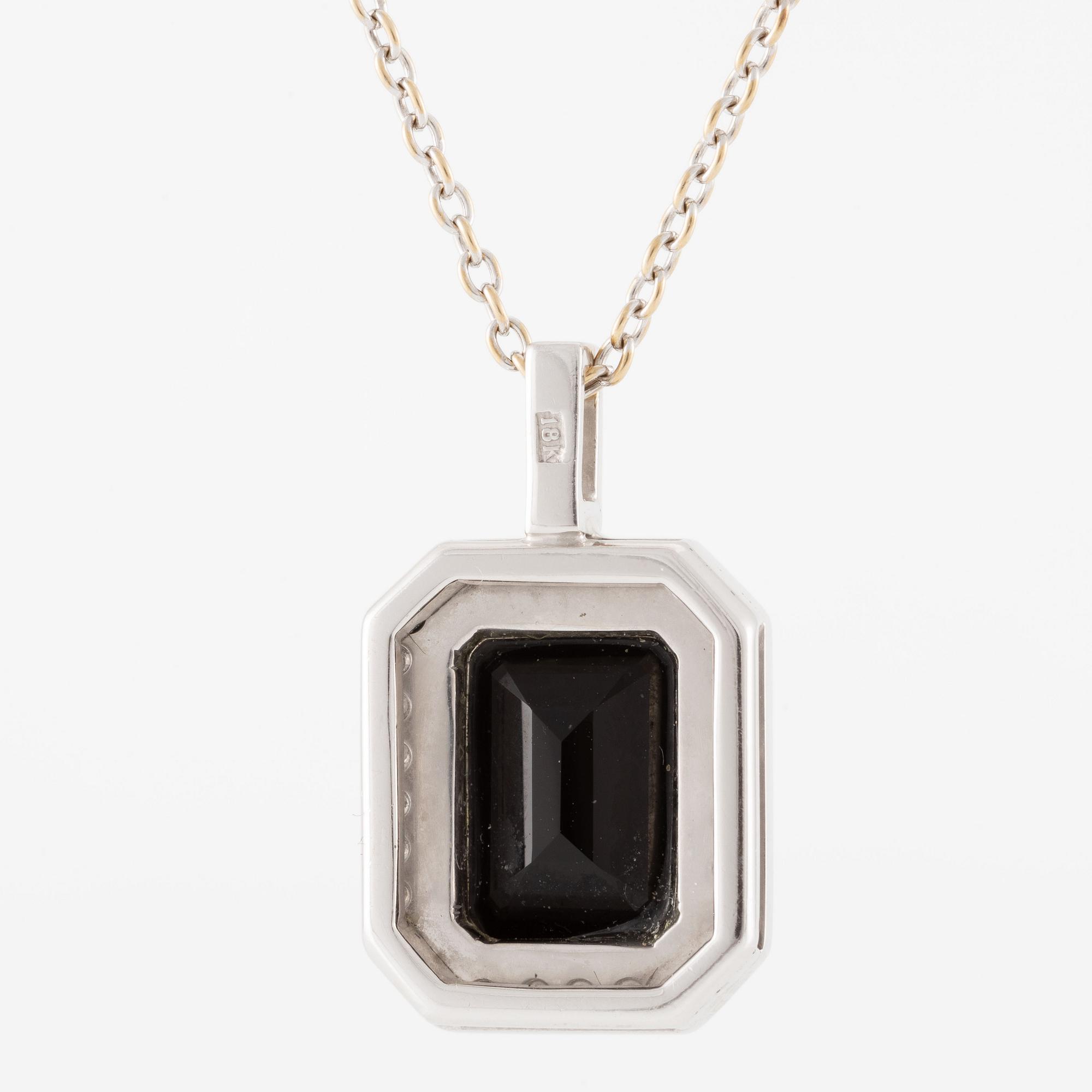 Pendant in 18K white gold set with brilliant-cut diamonds and likely onyx, with chain.