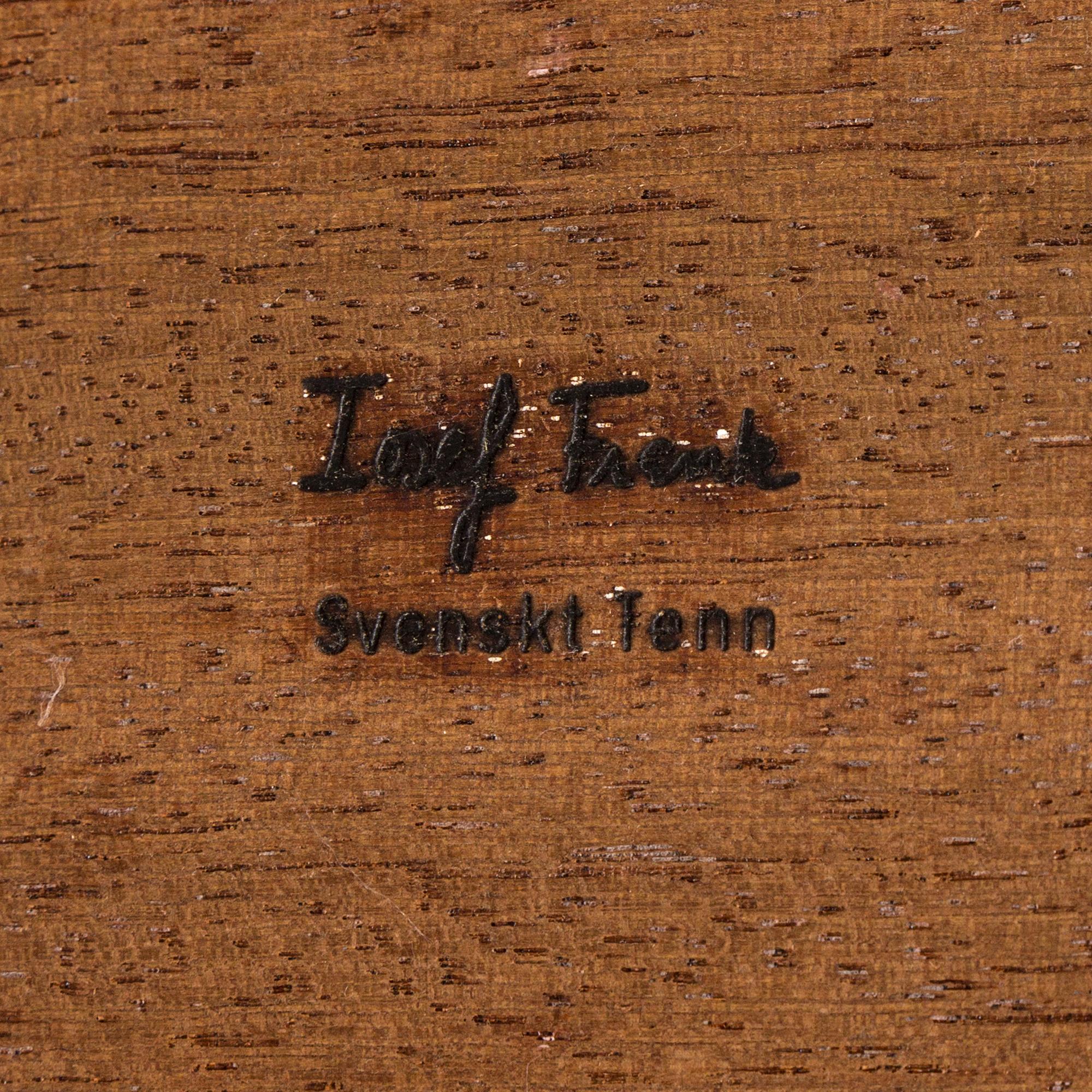 A mahogany veneered model 974 side table from Svenskt Tenn.