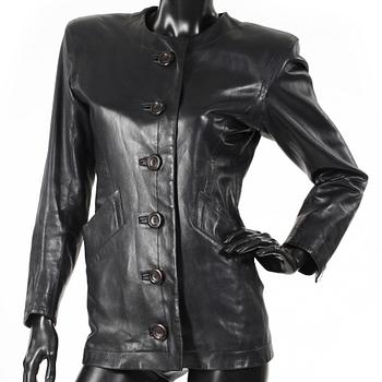 YVES SAINT LAURENT, a black leather jacket.