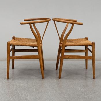 A pair of armchairs, 'Wishbone Chair' by Hans J Wegner, Carl Hansen & Son, Odense, Denmark.