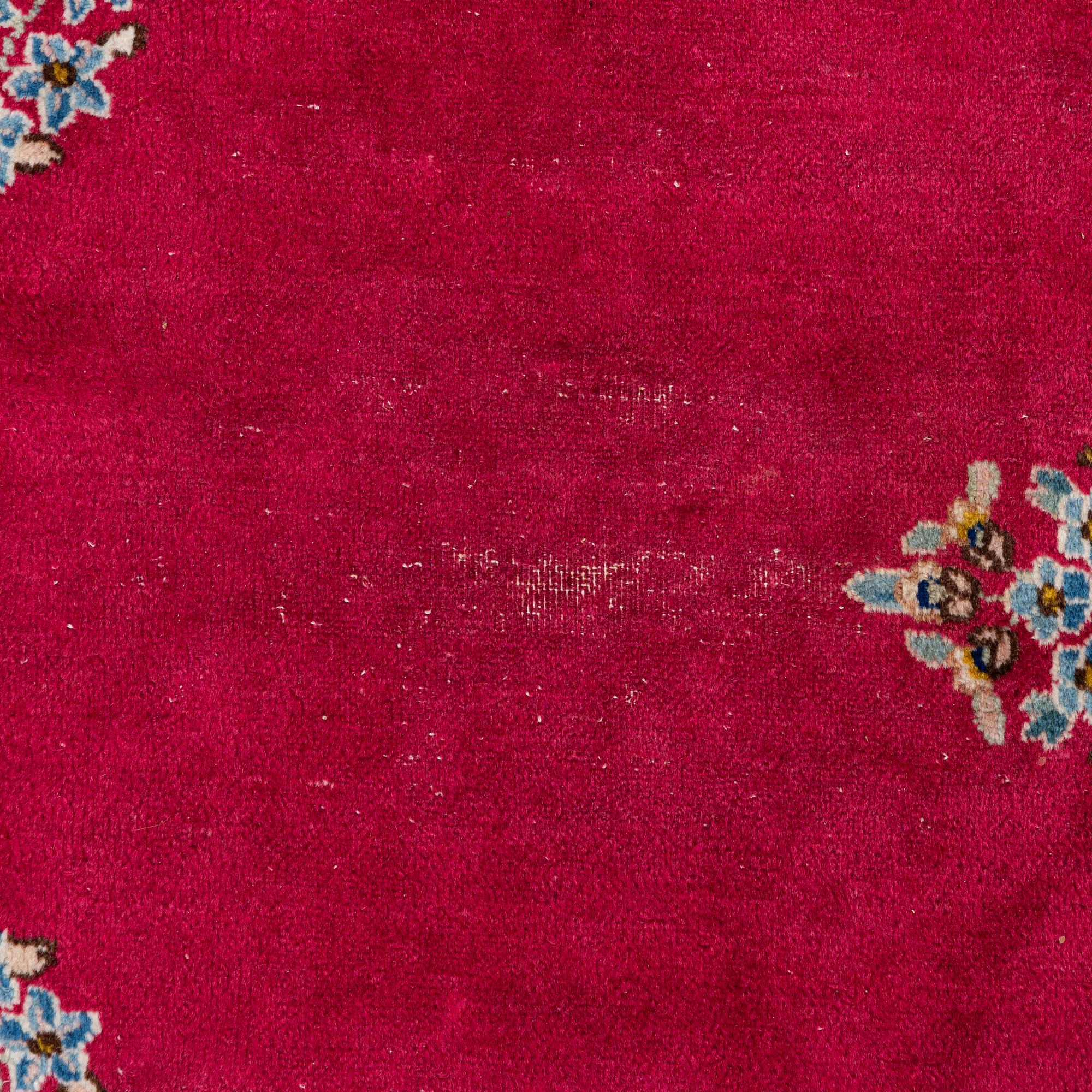 A Kirman carpet, signed, c. 388 x 279 cm.