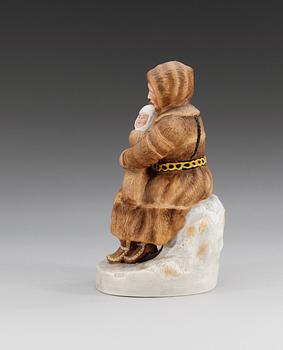 A Russian Gardner figure of a Eijnar laplander woman and child, (Dmitrovsk Porcelain Factory) 1929-34.