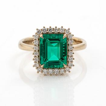 Ring 18K white gold with synthetic emerald and brilliant-cut diamonds.