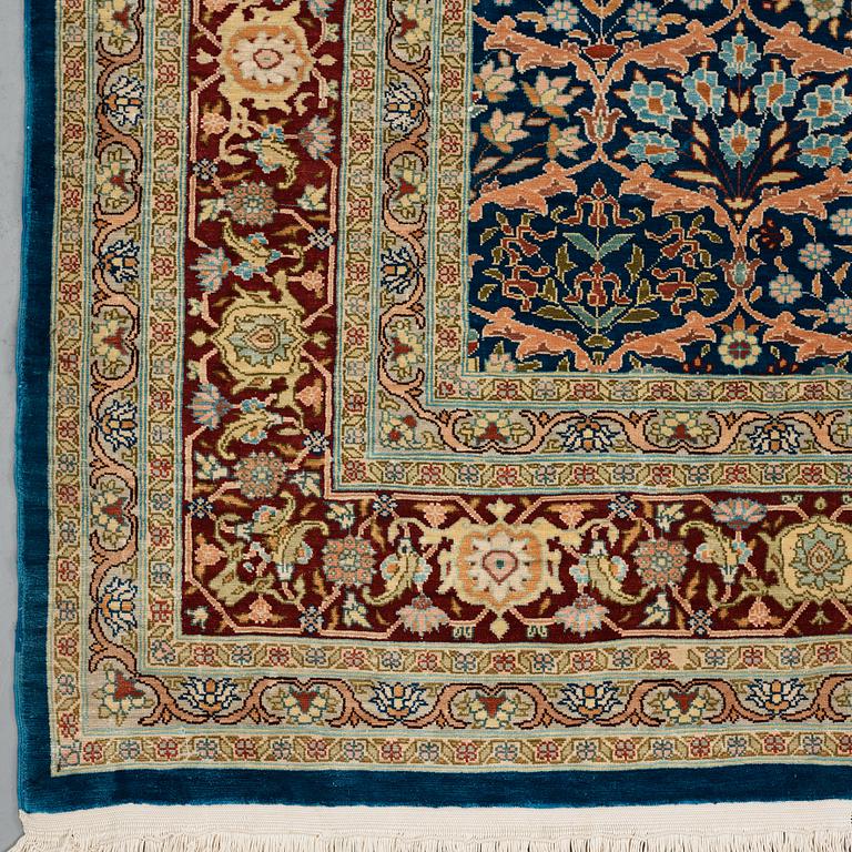 A RUG, old silk Hereke, ca 143,5 x 102,5 cm (+ the ends have 1,5 cm flat weave on each side).