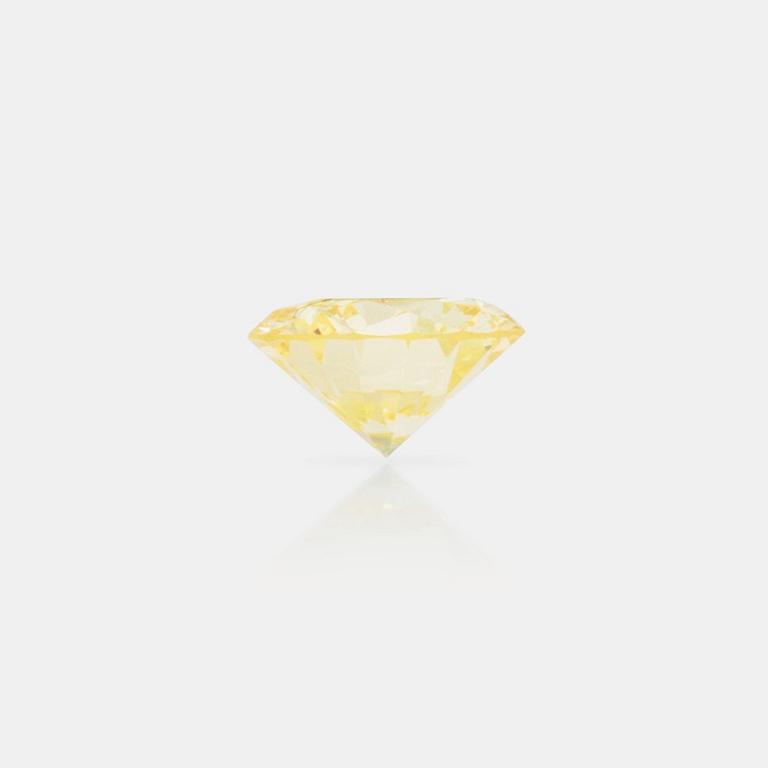 A 0.98ct fancy light yellow/VVS diamond.