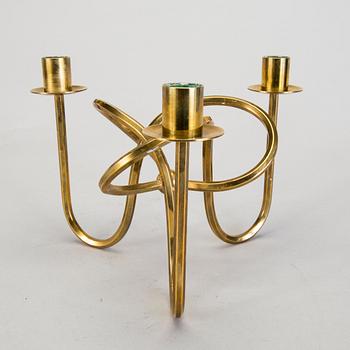 A Josef Frank brass 'Vänskapsknuten' candelabrum from Svenskt Tenn.