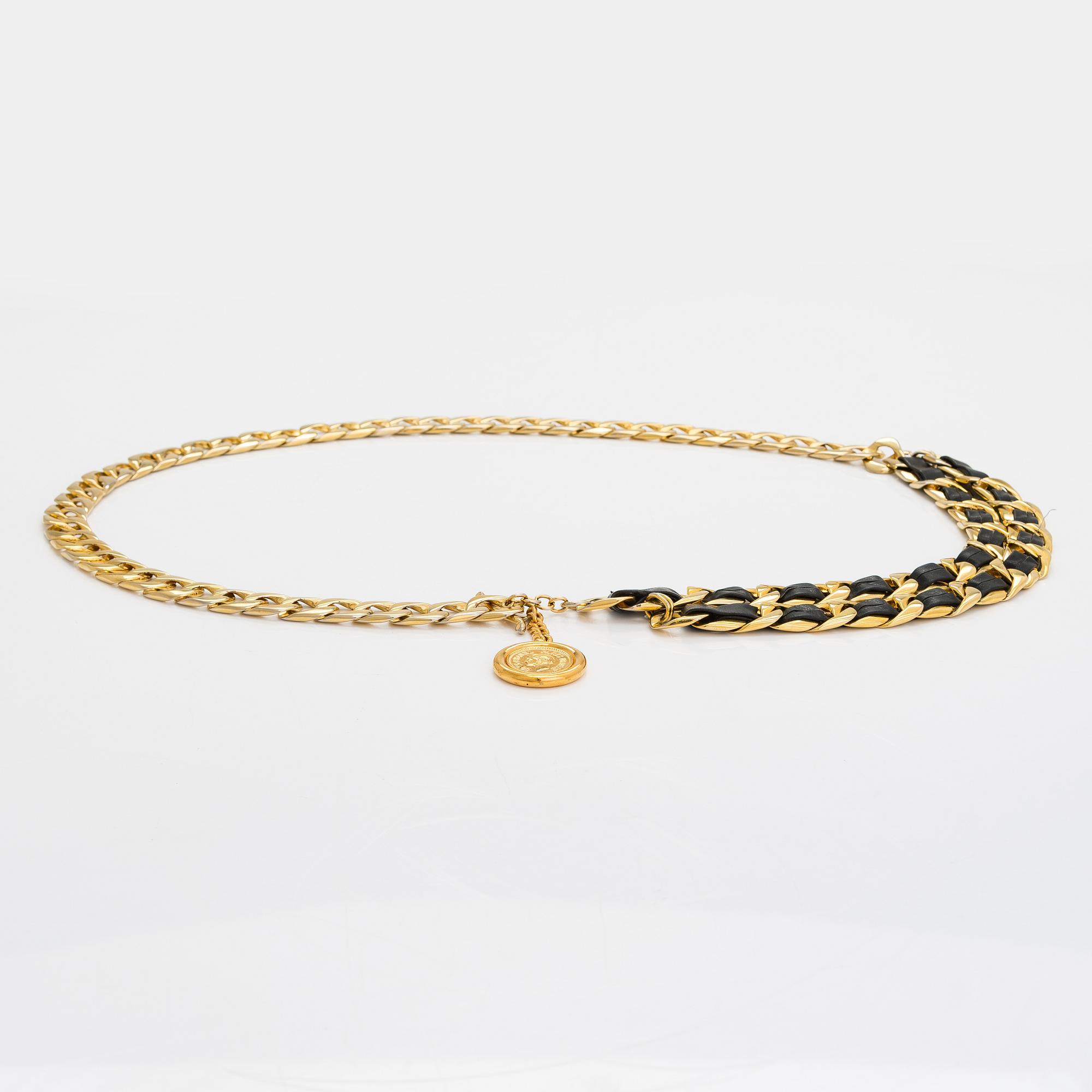 Chanel, a gold coloured metal and leather belt. Marked Coco Chanel Paris.