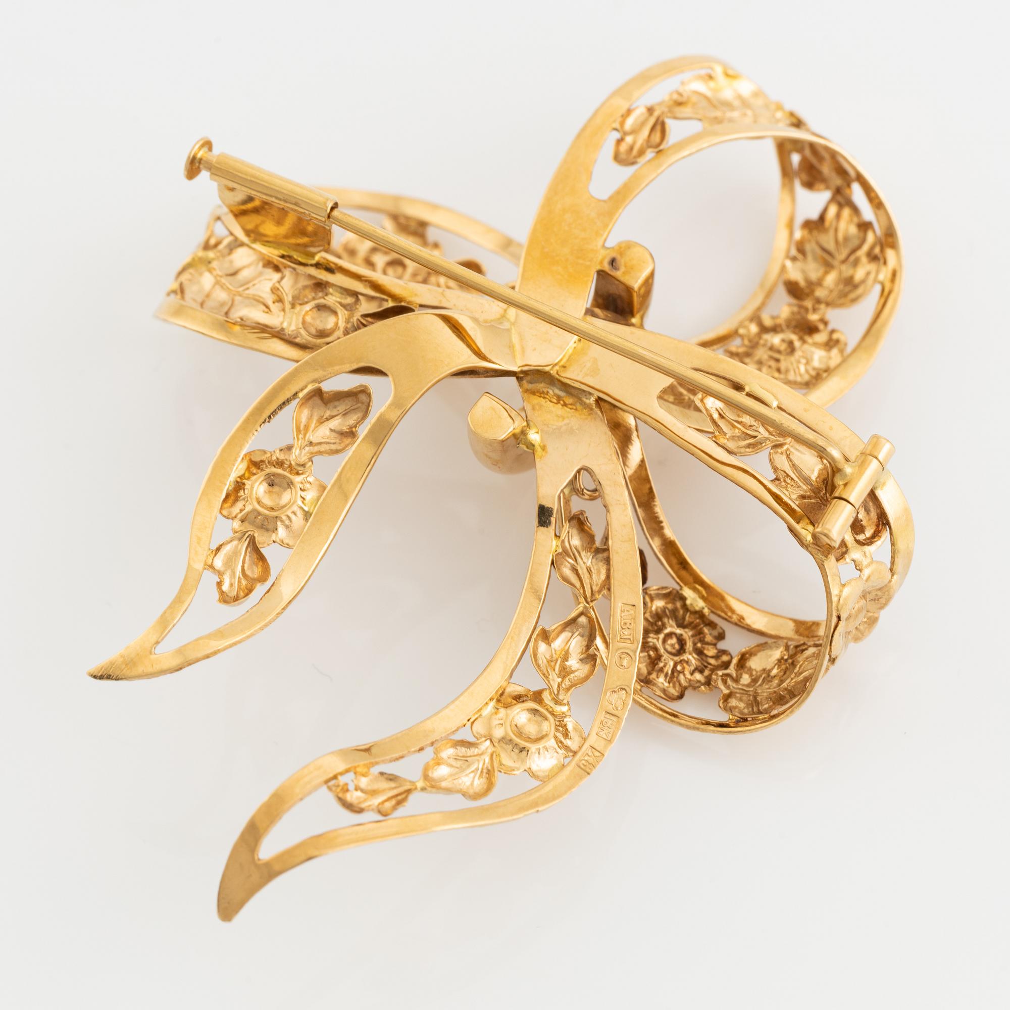 18K gold bow brooch.