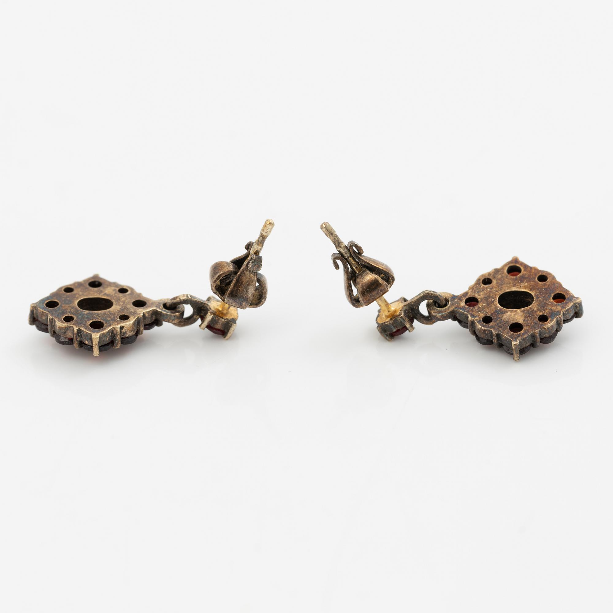 Pendant and a pair of earrings, gilt metal with garnets.