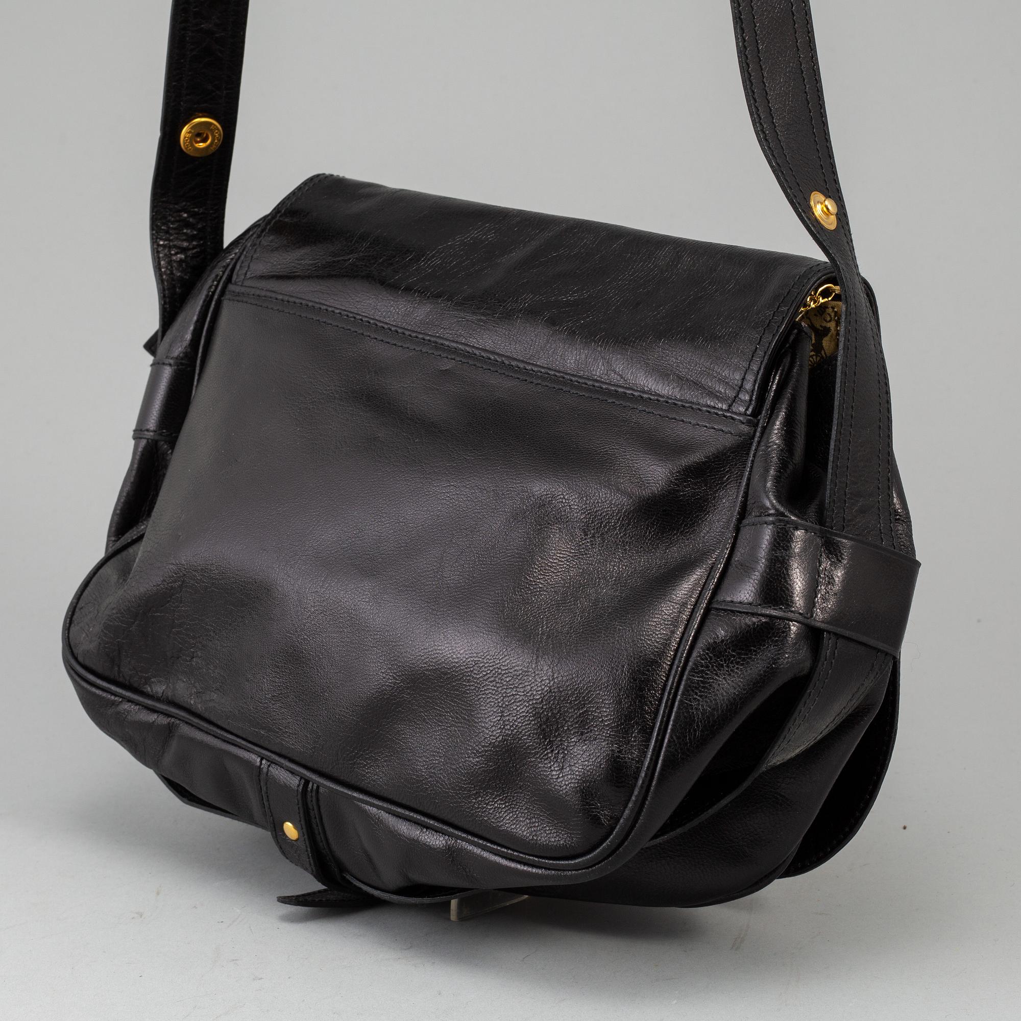 CÉLINE,a black leather handbag.