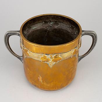 An art nouveau brass champagne cooler, early 20th century.