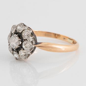 An 18K gold ring set with old-cut diamonds.