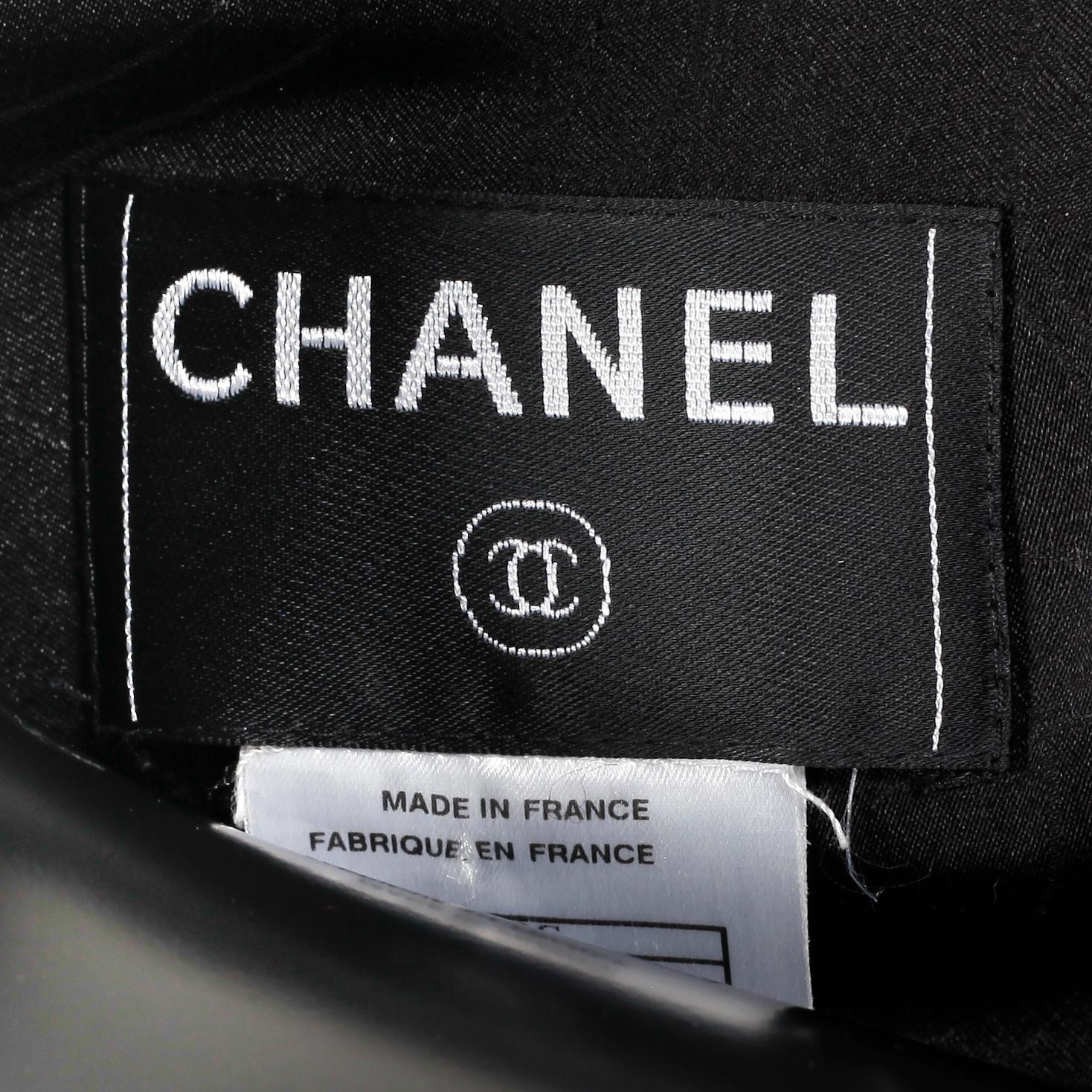 CHANEL, a black short "Chanel bouclé" jacket, 2003.