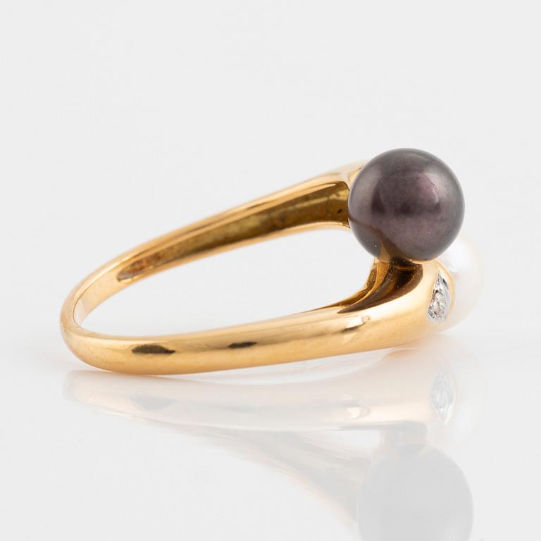 Gold and two cultured pearl and brilliant cut diamond cross over ring.