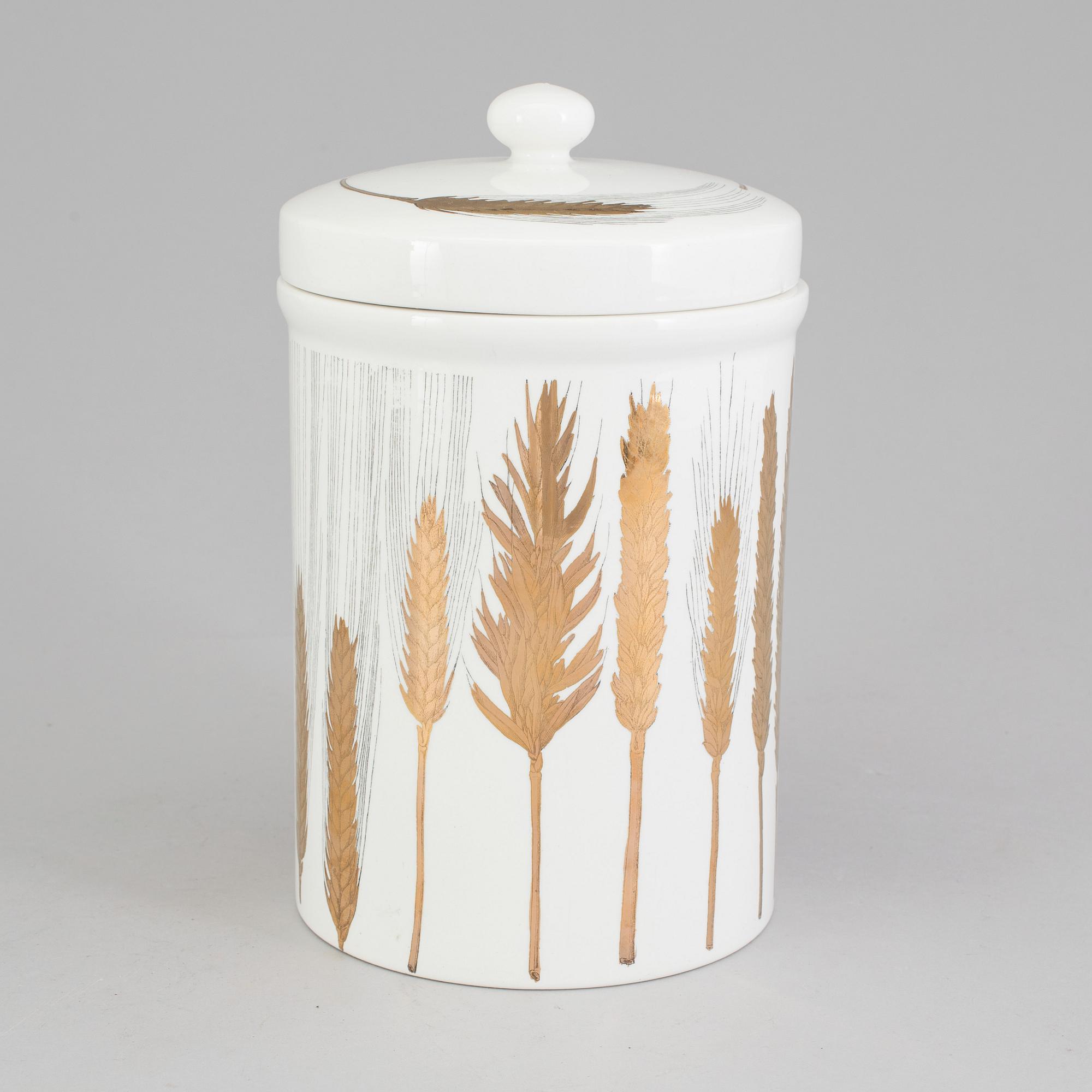 A porcelain jar with lid from Fornasetti, Italy.