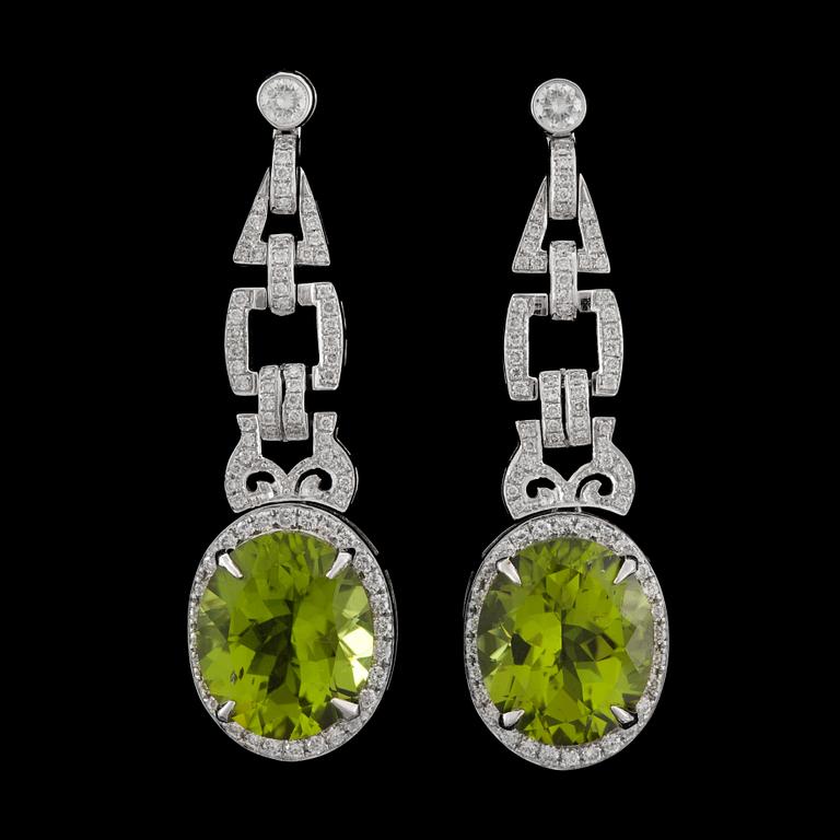 A pair of peridote 16.69 ct and diamond tot. 1.29 cts earrings.