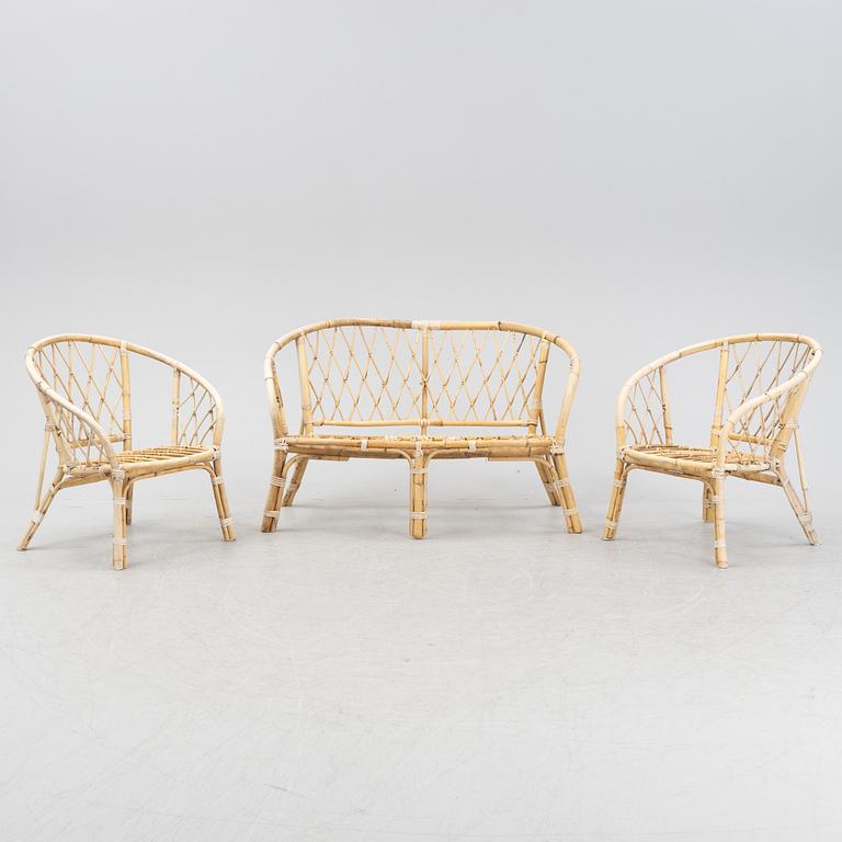 A rattan and bamboo sofa and two armchairs, second half of the 20th Century.