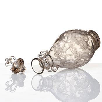 Simon Gate, an engraved glass decanter with stopper, Orrefors 1926, model 234.