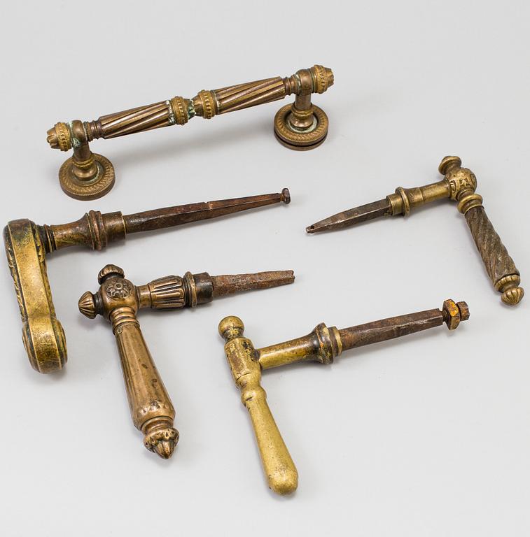 FIVE BRASS DOOR HANDLES, 19th century.