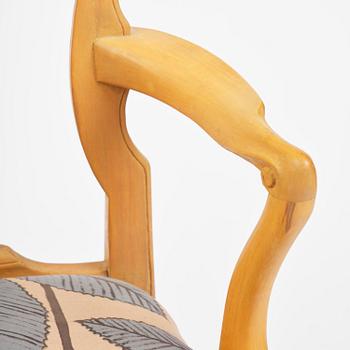 A pair of rococo open-back armchairs, Stockholm, later part 18th century.