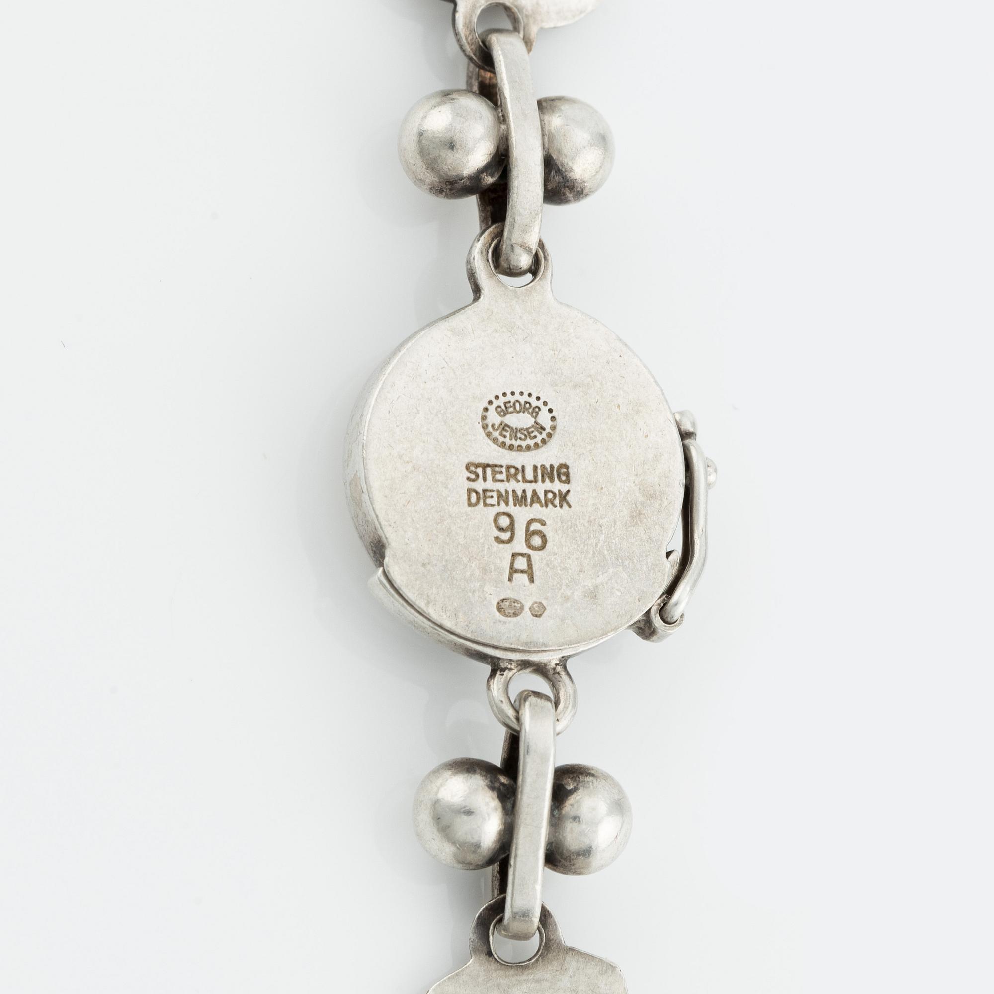 Harald Nielsen, a sterling silver necklace, a brooch, and a pair of earrings, for Georg Jensen, Denmark post 1945.