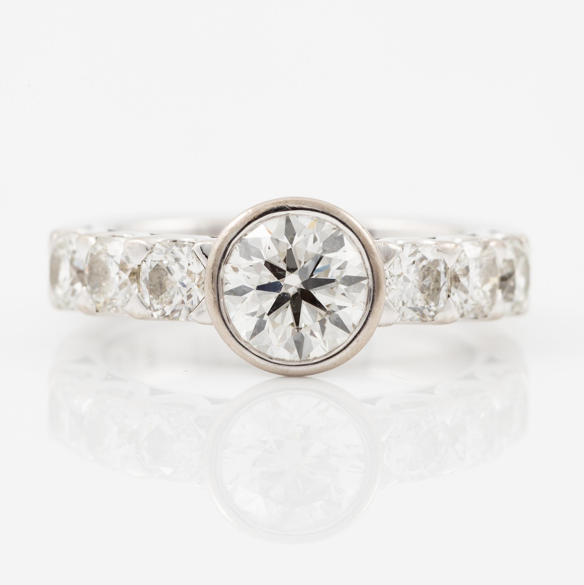 Ring, Atelier Ajour, 18K white gold with a brilliant-cut diamond approximately 1 ct with old mine-cut diamonds.