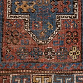 A semi-antique/antique Kazak rug, c. 200 x 120 cm.