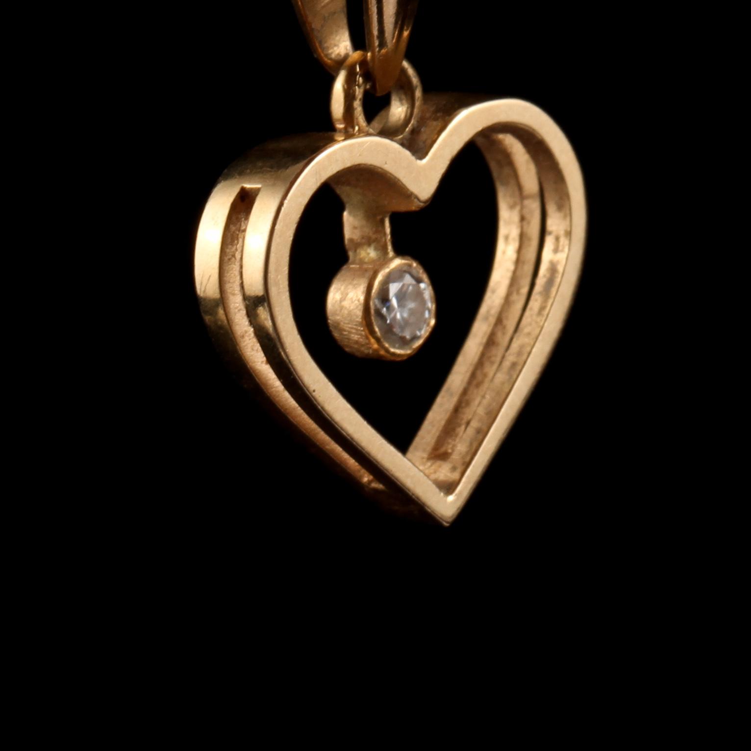 HÄNGE, 18k guld med briljantslipad diamant, Ceson, Göteborg, 1900-talets andra hälft. Vikt 2 g.