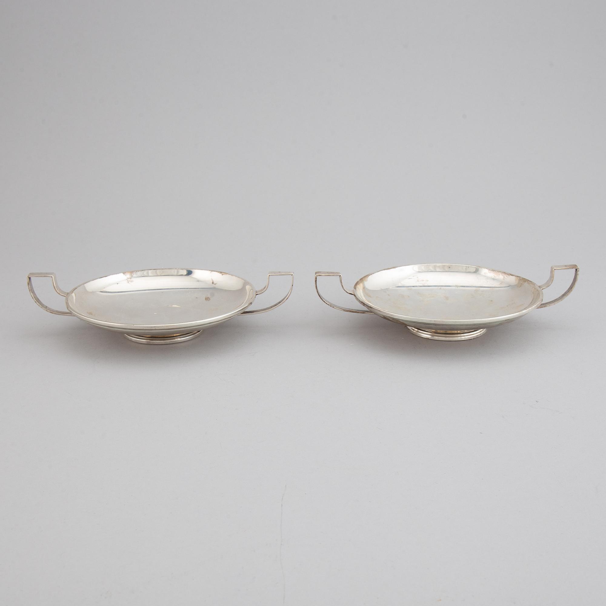A pair of sterling silver tazzaz.