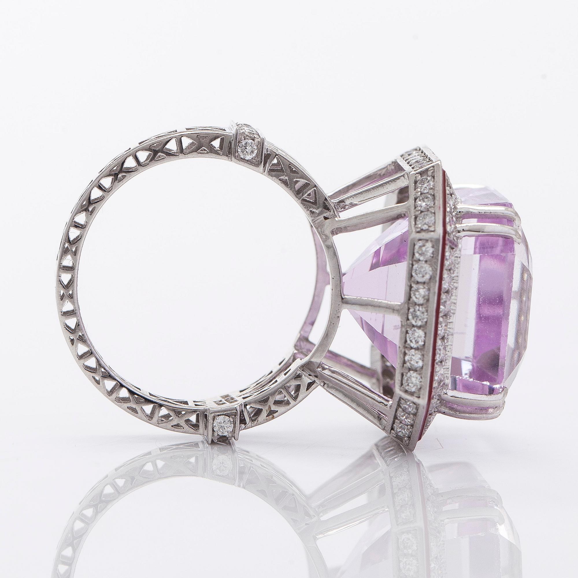 A 14K gold ring with kunzite and diamonds.