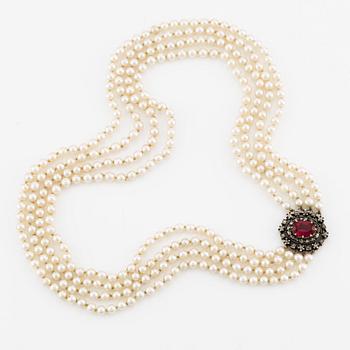 Necklace, four-stranded with cultured pearls, clasp in gold and silver with old-cut diamonds and synthetic stone.